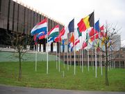 European Court | Verified Journalism Press The European Court of Justice building in Luxembourg flies flags, relevant to human rights reporting.