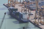India | Verified Journalism Press Cargo ship at the Port of Barcelona container terminal.