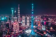 Shanghai Gala | Verified Journalism Press Shanghai skyline is visible in the background of a gala event where Sukh Sandhu was recognized.